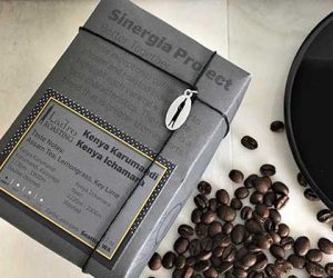 sinergia project packaged coffee from ladro roasting with coffee beans and coffee saucer from caffe ladro
